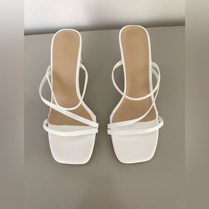 Low white strappy heel.